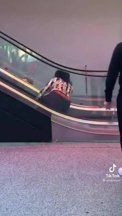 Falling down the escalator.