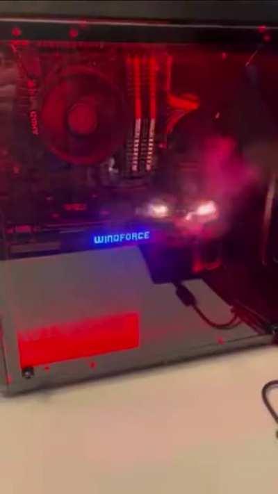 Dudes reaction of the burnout of new pc build in the reflection was on point