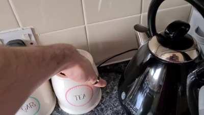 Making a cup of canis root tea in a cappuccino mug.