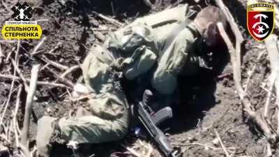UA POV - Very graphic, a Russian soldier takes a direct hit from a drone munition while loading magazines. Agonal breathing is visible.