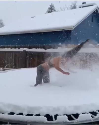 Backflip on a snowy trampoline