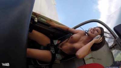 She’s having a good time. Topless plane loops