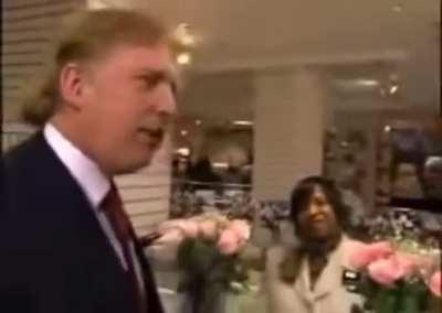 Donald Trump motorboating his former lawyer, Rudy Guiliani, in drag