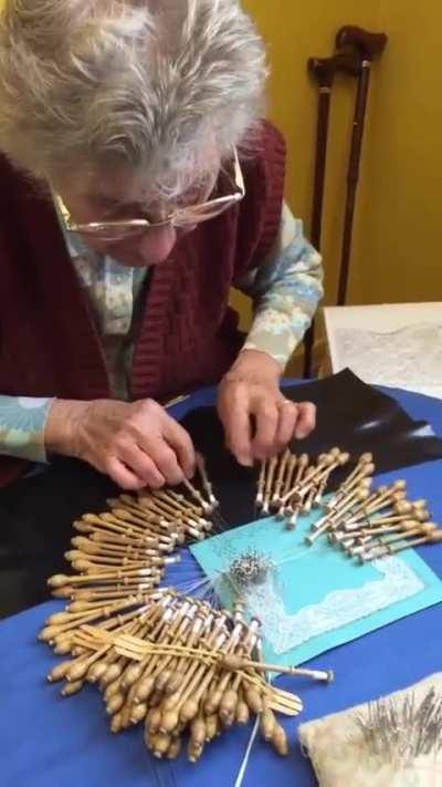 Grandma still retains the art of lacing, creating a piece for a relative 