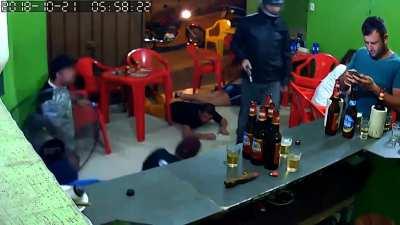 Guy at the bar playing with his phone is totally oblivious to the armed robbery all around him.