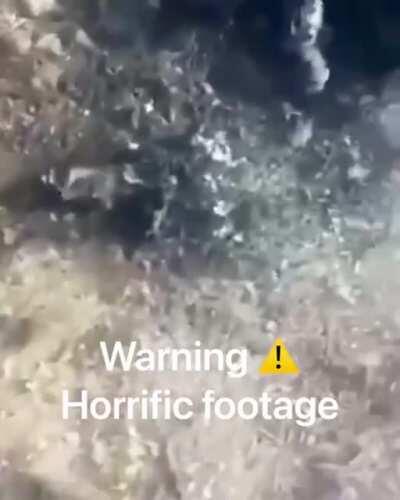 Azerbaijani forces burning captured Armenian civilians and soldiers.