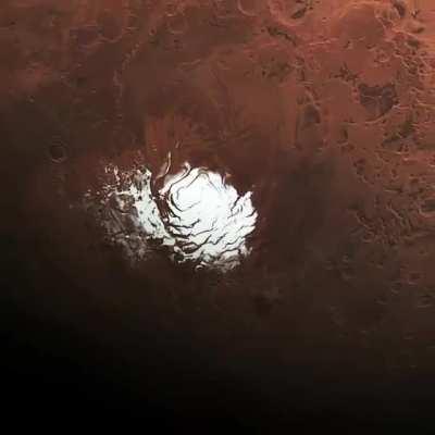 Frozen water and frozen carbon dioxide at the south pole of Mars, as filmed by the Mars Express spacecraft.