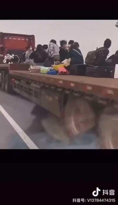 Collage of Foxconn workers escaping the gigantic COVID outbreak in Zhengzhou, China