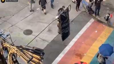 Car speeding into protest in Seattle, an apparent shooting, and the man getting out with a gun.