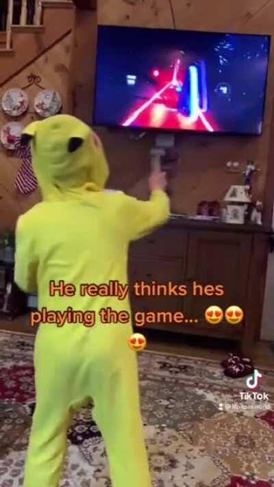 Lil dude thinks he’s playing beat saber.