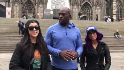 Sasha Banks touring Cologne, Germany with Titus O’Neil and Bayley.