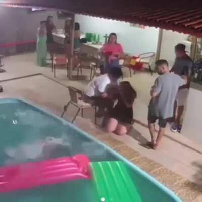 Wearing heels by a swimming pool