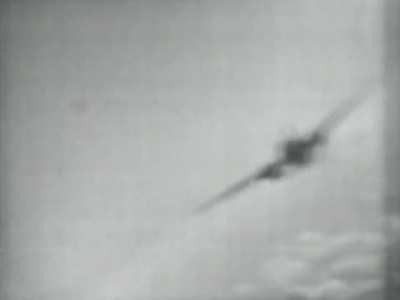 Japanese Mitsubishi G4M2e mothership carrying a Yokosuka MXY-7 Ohka kamikaze rocket plane targeted by a US Navy fighter in 1945