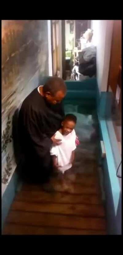 Little kid baptises himself because he was too excited.