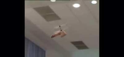 Flying dildo makes guy at Russian press angry