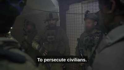 Commander of the 98th Division talks to his men, in a tunnel in Khan Yunis