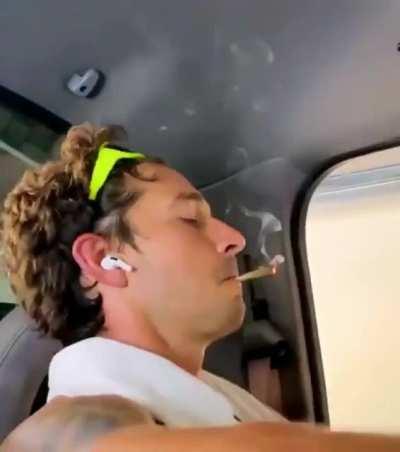 shia lebeouf in his car smoking weed while listening to “be yourself”