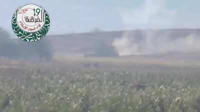At least one crewman bails after a Syrian Army tank is engaged by an opposition ATGM team - 2014