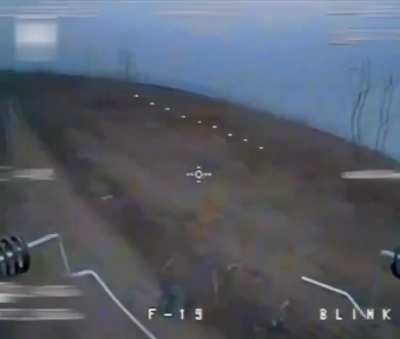 Russian soldiers are targeted and hit by Ukrainian FPV drones, including one soldier who stands still in hopes of avoiding being detected by a drone