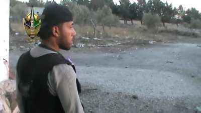 FSA Saif al-Sham Brigade fighters make a dangerous street crossing under direct fire - Tal al-Hara - 2014
