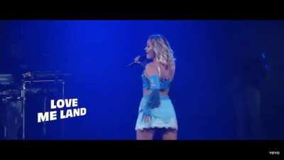 Touching her own butt