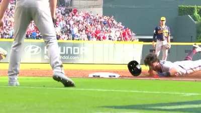 Dansby Swanson face plants sliding into third.