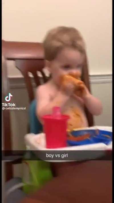 Little boy covers himself in pasta while his sister stares in shock