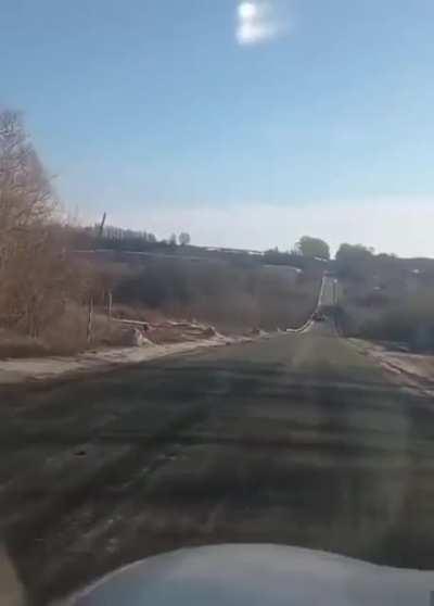 Soldiers say they are out of gas. Driver offers to tow them back to russia. Everyone laughs. Russian soldiers ask for news on how they are doing in war. Driver tell them that Ukraine is winning, russians are surrendering and impliest that they should too.