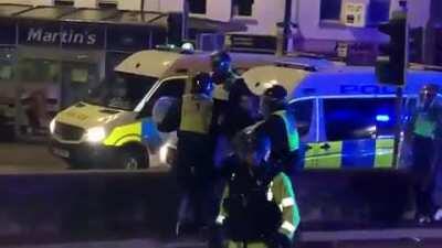 Good boy police dog sees sees cop acting aggressively, bites the cop and frees the protester.