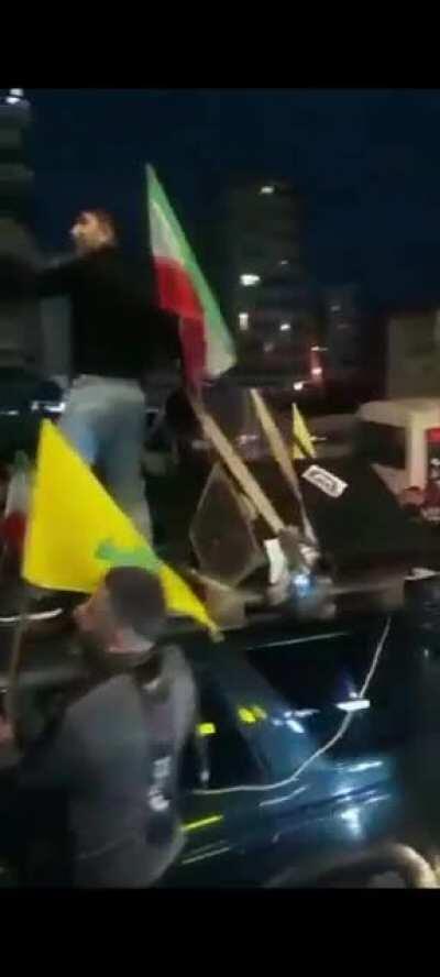 Hezbollah supporters are rallying tonight in Dahyeh carrying the Iranian flag as a response for the call for neutrality by the Patriarch.