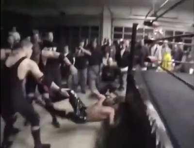 Wrestler misses the ropes and knocks himself out.