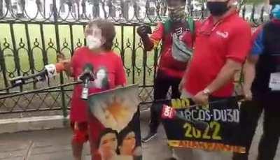 LOOK: A Marcos loyalist stages a protest rally in front of the COMELEC office (from Philippine Star)