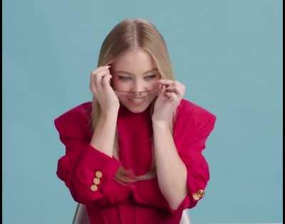 Sydney Putting on Her Glasses