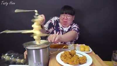 Putting cheese in a chocolate fountain