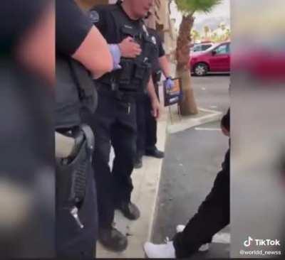 Police officer “detains” guy after getting in his face