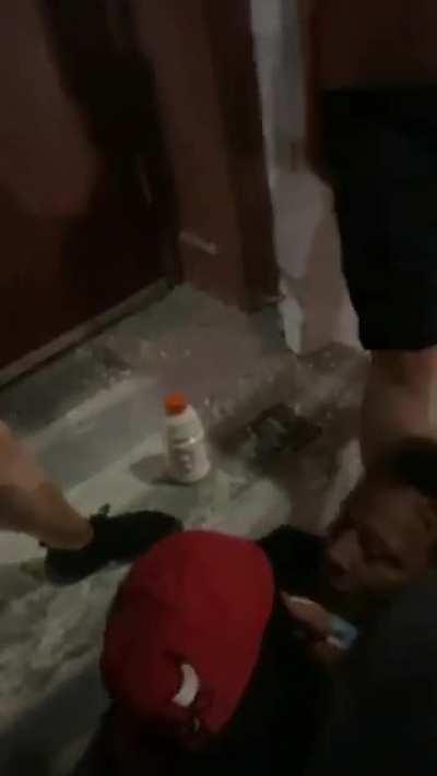 Looters knock out an old man who was defending his store with a fire extinguisher