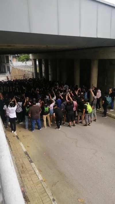 Malaysian fans singing along to Time Is Running Out while waiting for gates to open