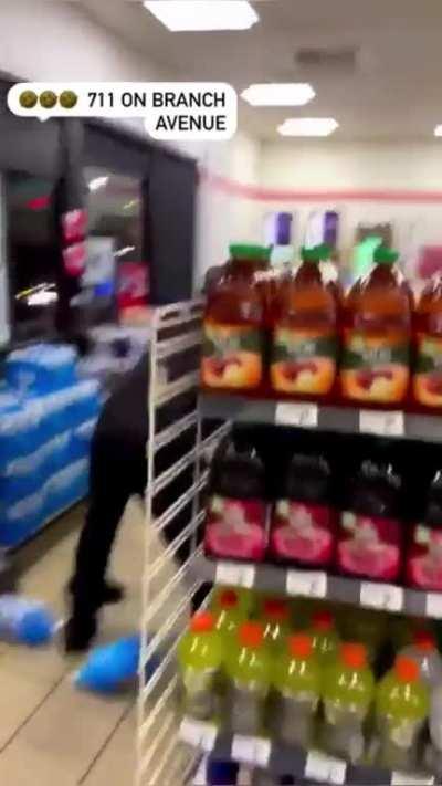 7/11 workers tag team a bum in a brawl