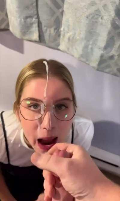 Cute girl gets her face covered with cum