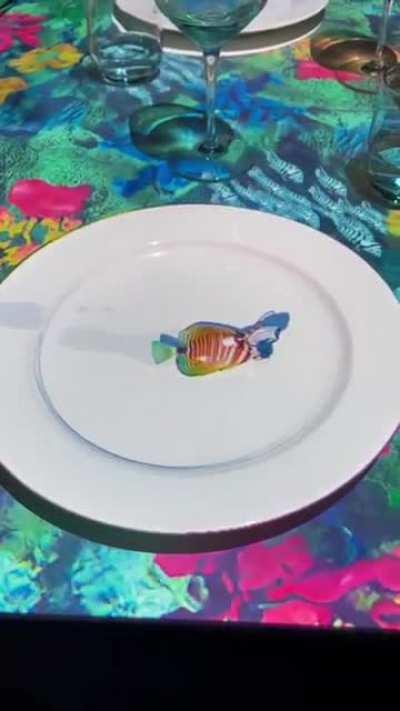 Restaurant with video mapping on their tables