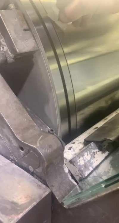 Trying to clean off a flammable substance from a rolling drum