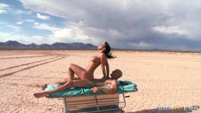 Rachel Starr bouncing in the desert
