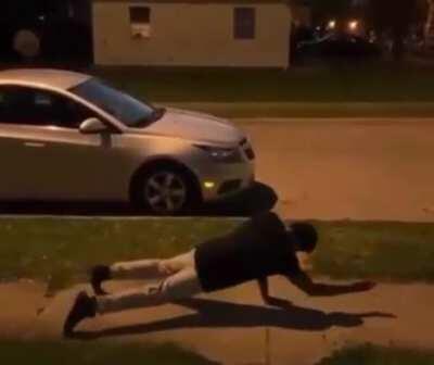 Saw an unnamed superhero on the sidewalk.