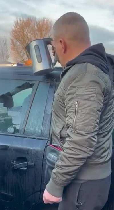 Being clever cleaning ice off a car window