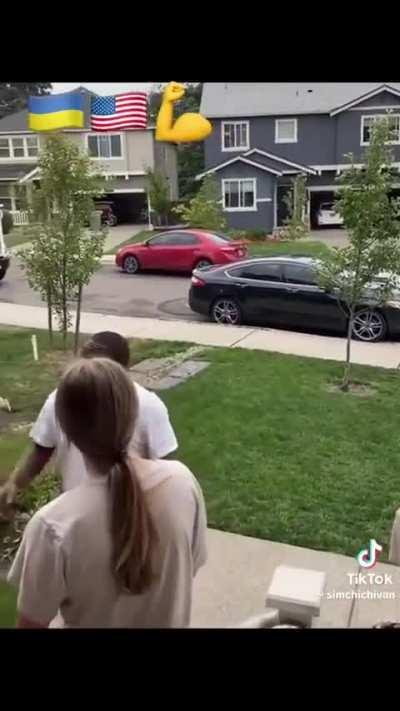 An American speaks with and introduces himself in Ukrainian to his refugee neighbors