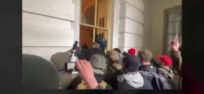 Rioters break windows to enter the U.S. Capitol