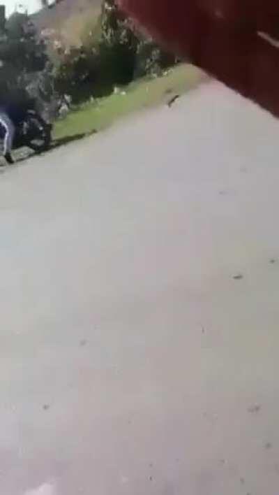 Guy tries to take a selfie while standing on a moving motorcycle