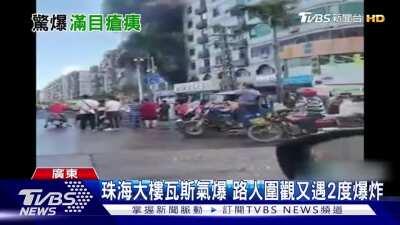 Hotel is on fire from gas explosion, explodes again as a crowd built up. Zhuhai City, China - 9/11/2020