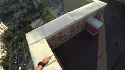 Guy catches himself with electrical wires after missing his jump