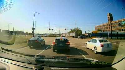 Idiot makes an illegal U-Turn in front of a train